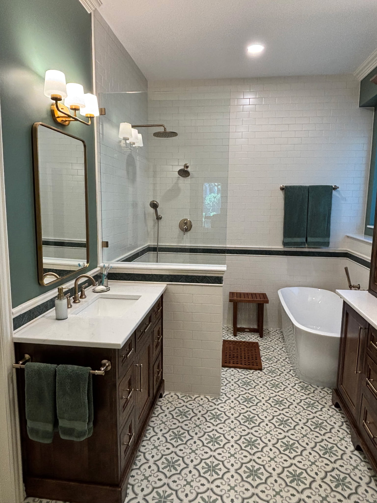 Bathroom remodel with glass shower and freestanding tub
